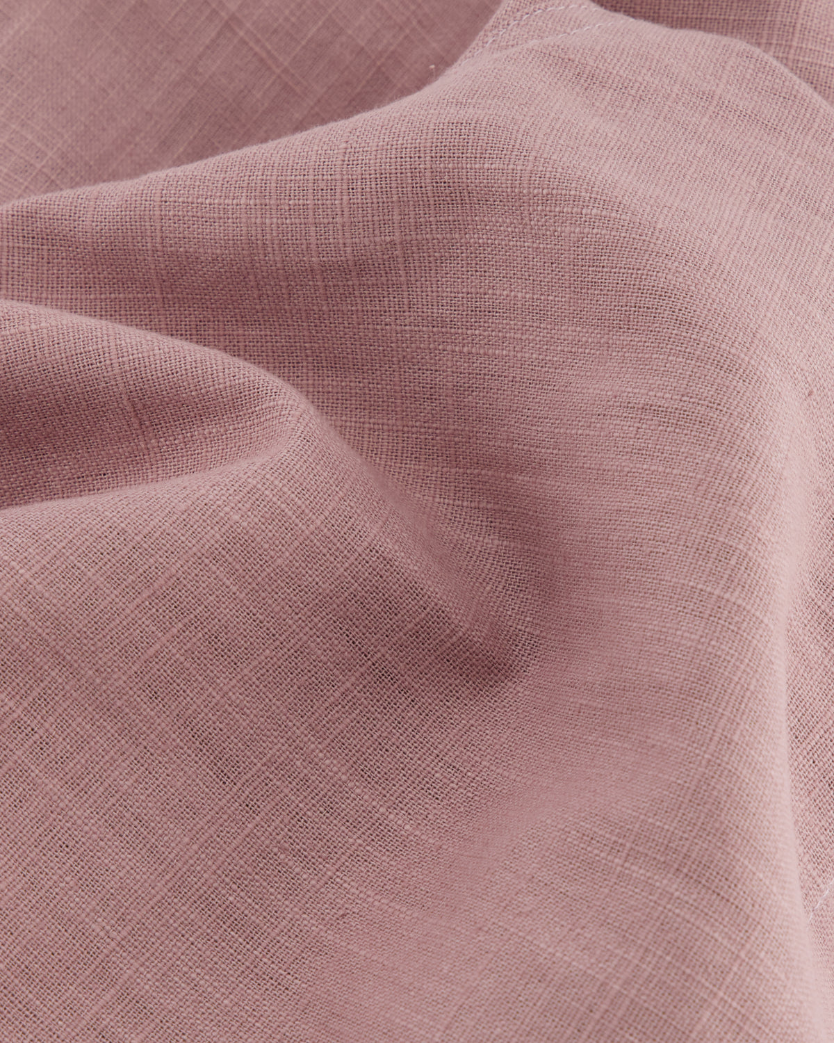 close up of high quality european linen mauve colored